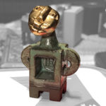 Keramik,vergoldet, Höhe 5cm, seit 2007, Souvenir und Symbol für alle Dessauer, ein Exemplar befindet sich im Grundstein des Bauhausmuseum Dessau